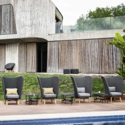 Peacock Highback lounge armchair, Cane-Line Natté dark grey, incl. grey cushions, legs in teak