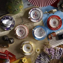 Wonderlust teacup with saucer, crimson jewel